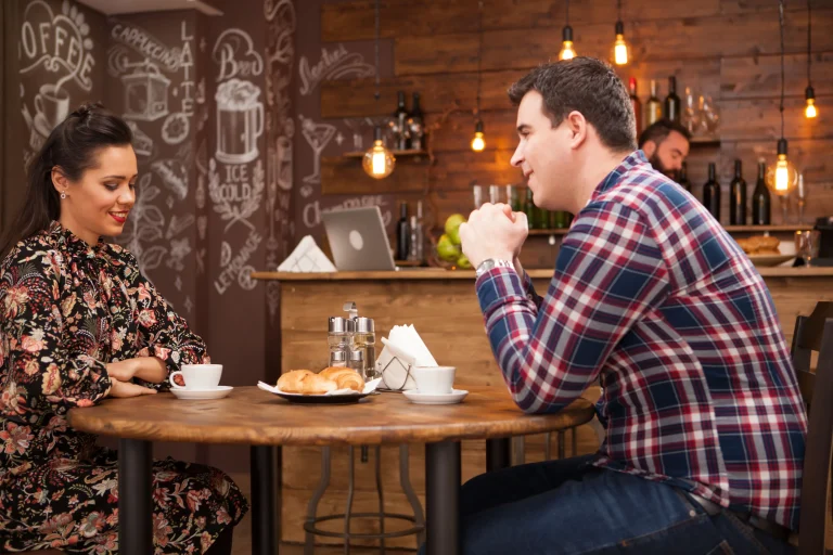 young-couple-talking-about-future-cozy-vintage-pub-night-out (1)